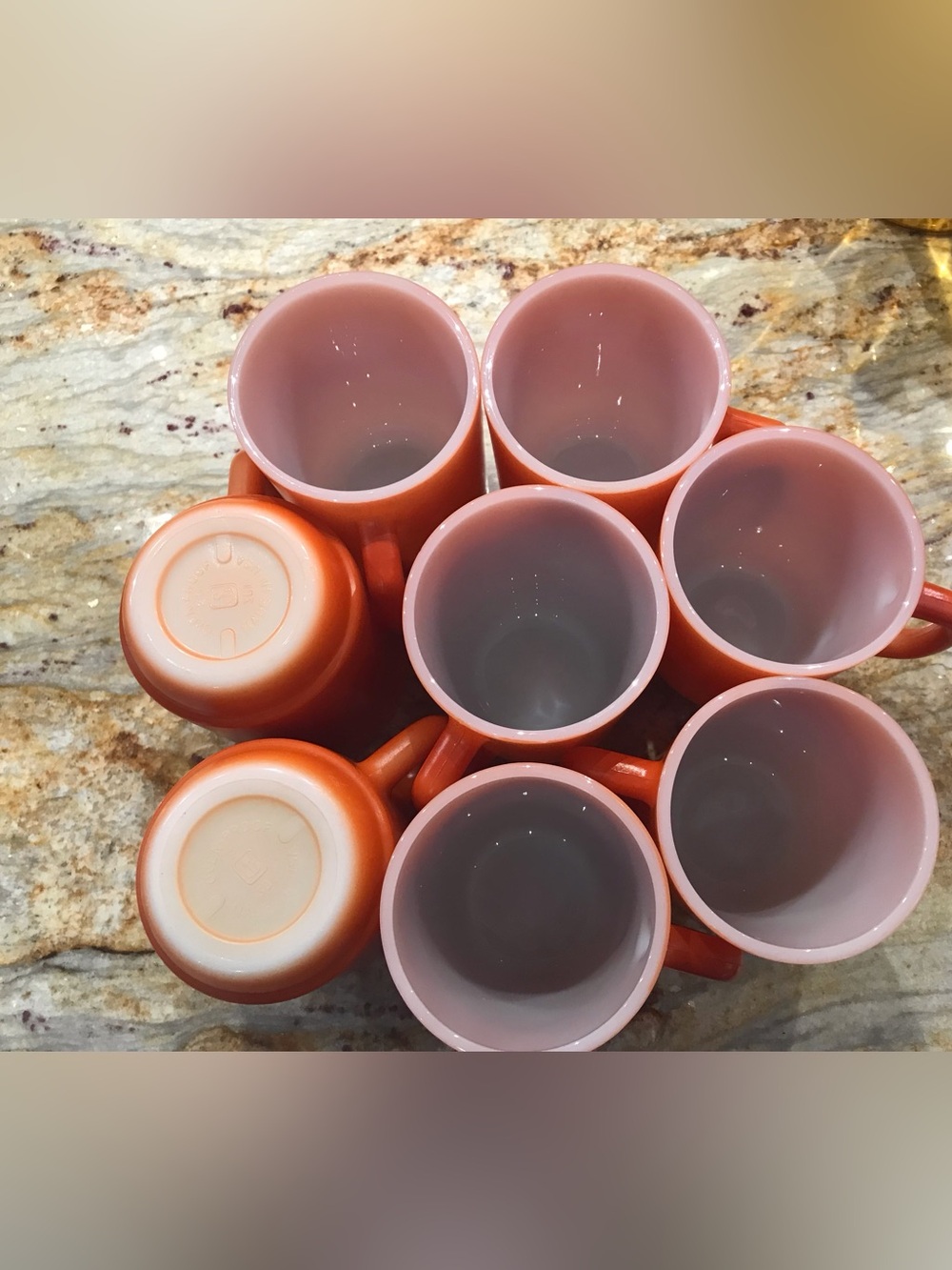 Anchor Hocking Vintage mugs.  Rust/orange colored.  8 total.  Made in USA,